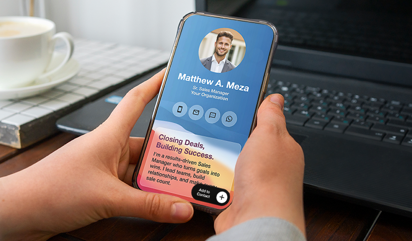 Phone showing a QRCodeChimp digital business card profile for a sales manager