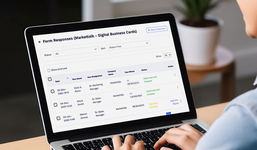 Laptop showing a digital business card request approval dashboard.